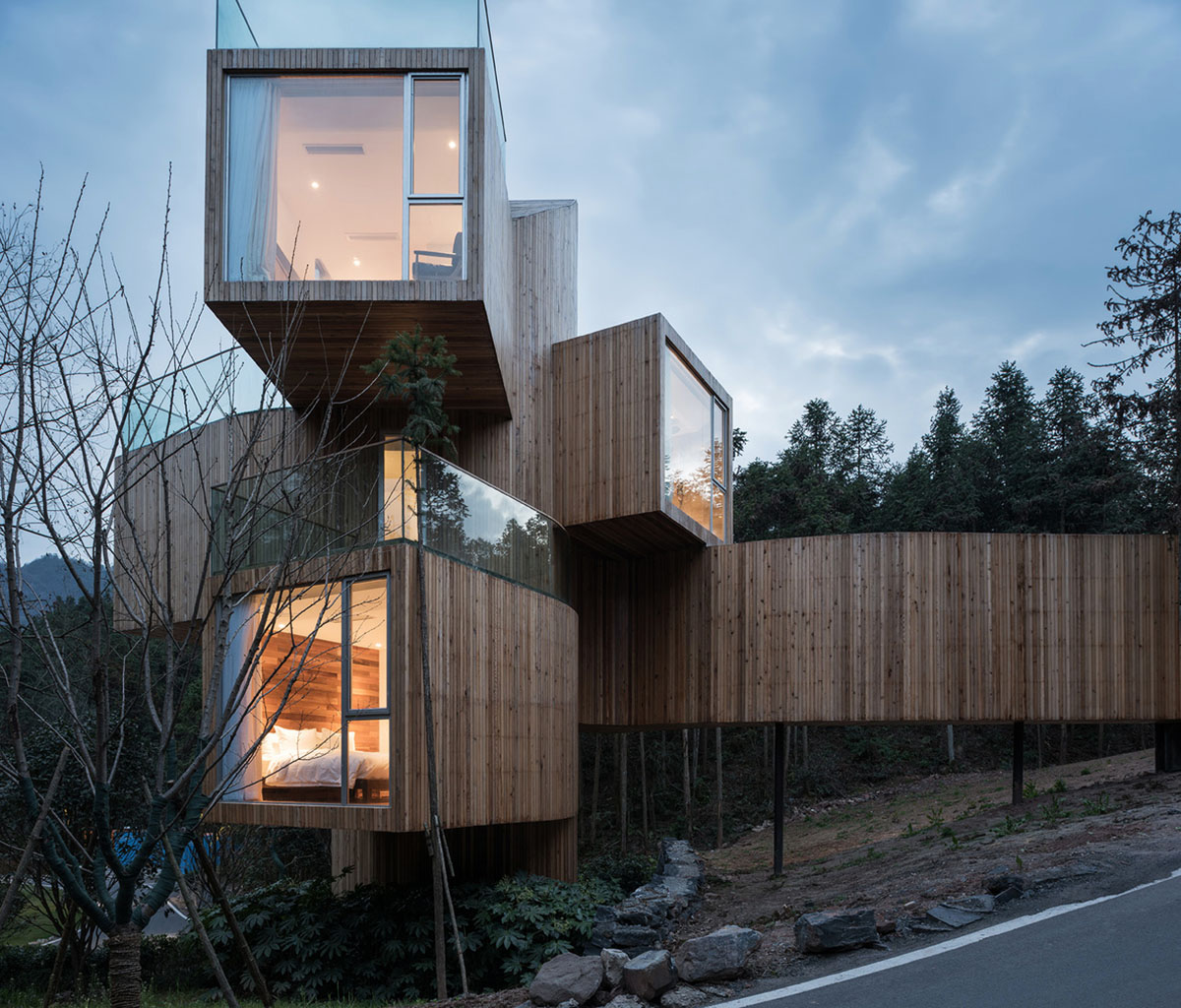 Bengo Studio joints multiple wooden rooms around a central staircase for Qiyun Mountain Tree Hotel