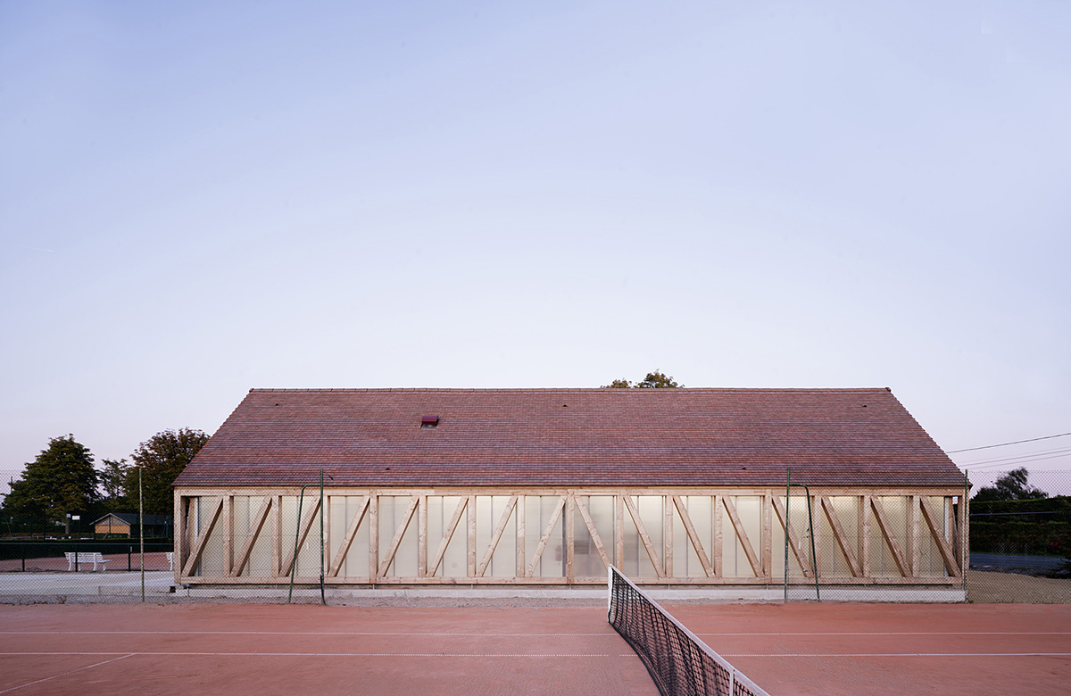Lemoal Lemoal Architectes wraps tennis club with half-timbered facade elements in Cabourg