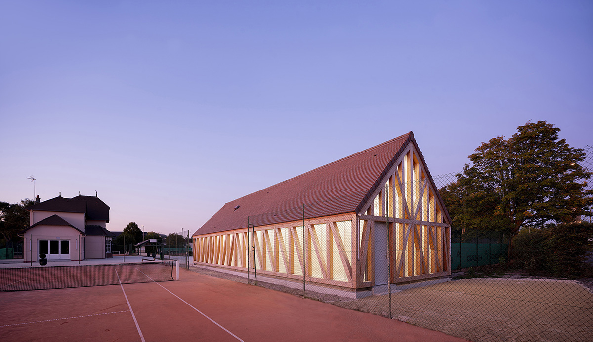 Lemoal Lemoal Architectes wraps tennis club with half-timbered facade elements in Cabourg