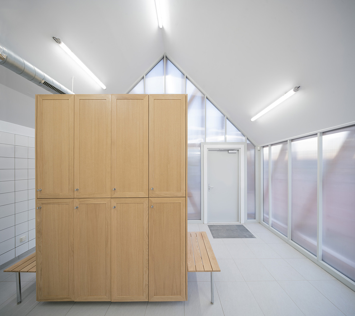 Lemoal Lemoal Architectes wraps tennis club with half-timbered facade elements in Cabourg