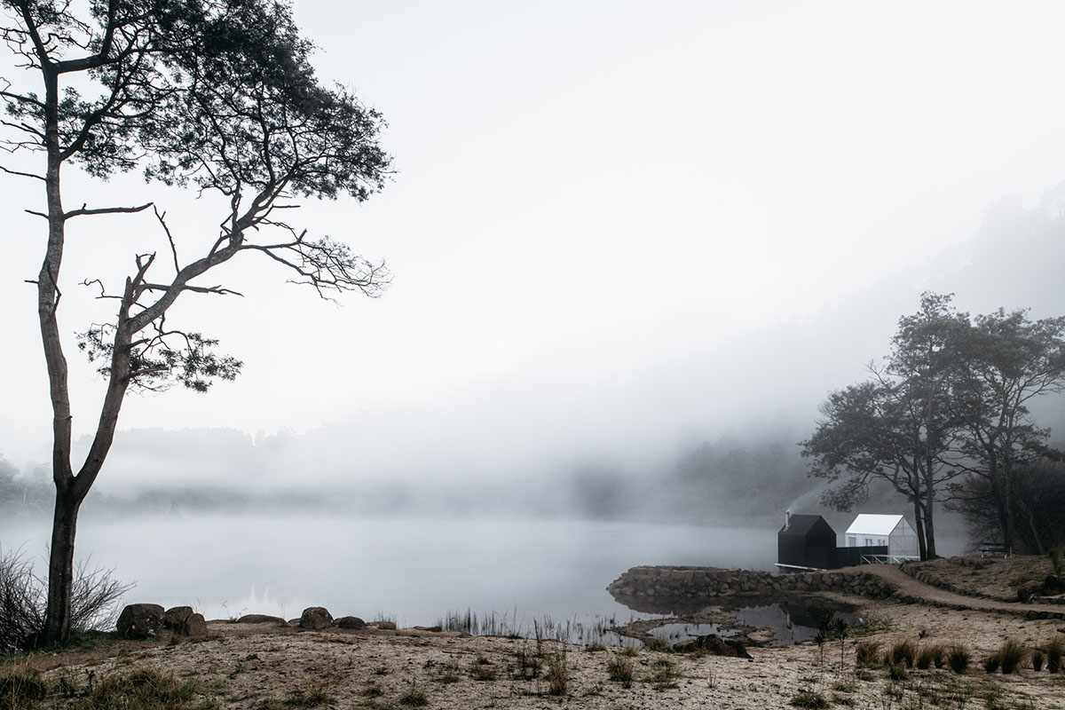 Licht Architecture built a floating sauna with black and white volumes on Tasmanian's Derby Lake