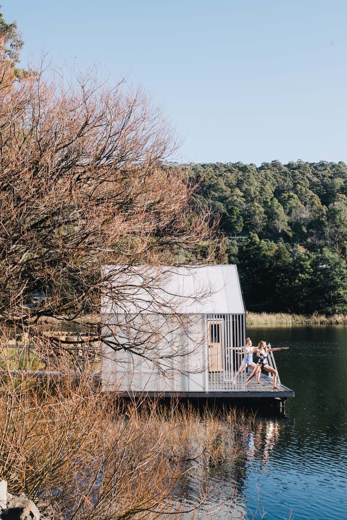 Licht Architecture built a floating sauna with black and white volumes on Tasmanian's Derby Lake
