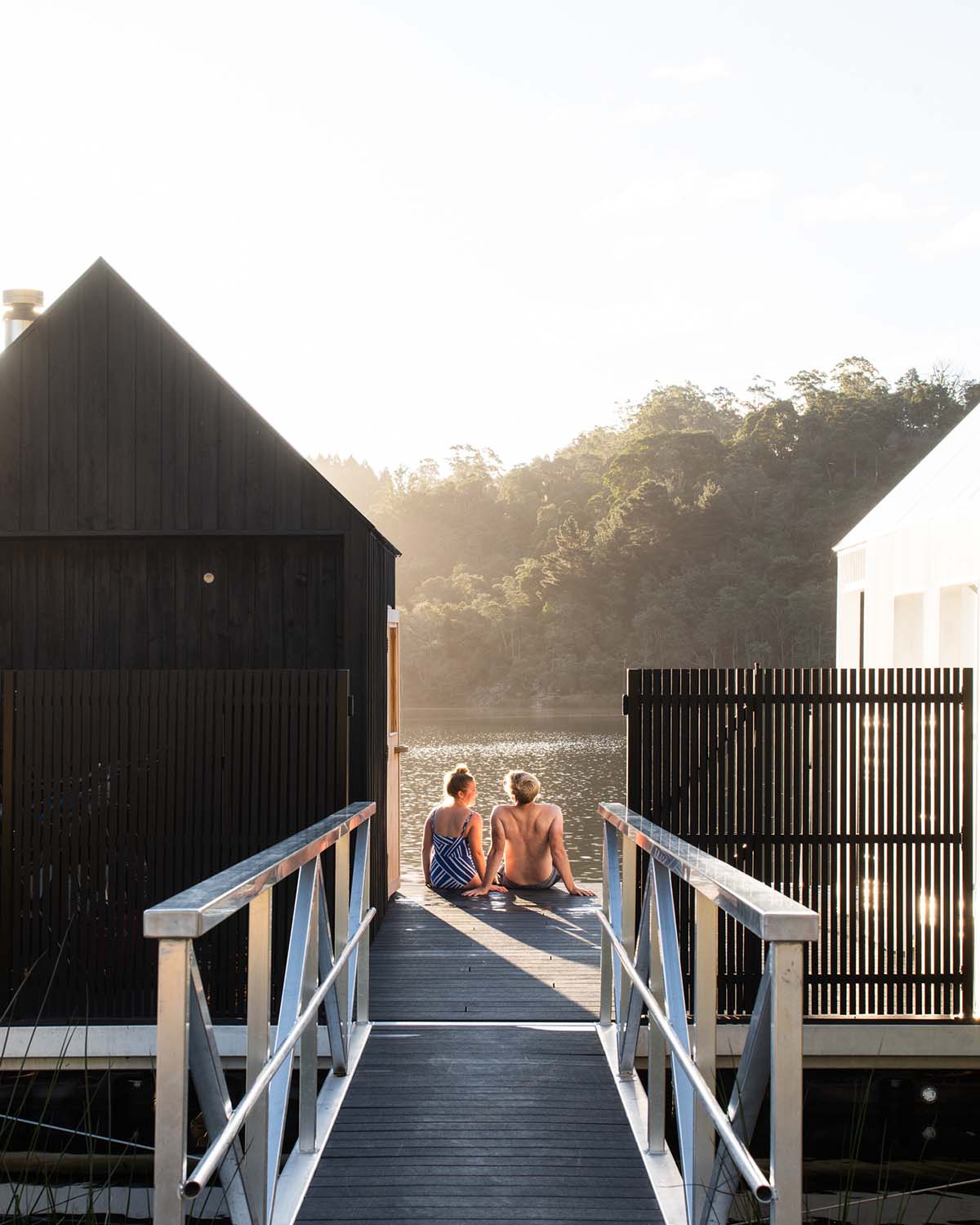 Licht Architecture built a floating sauna with black and white volumes on Tasmanian's Derby Lake