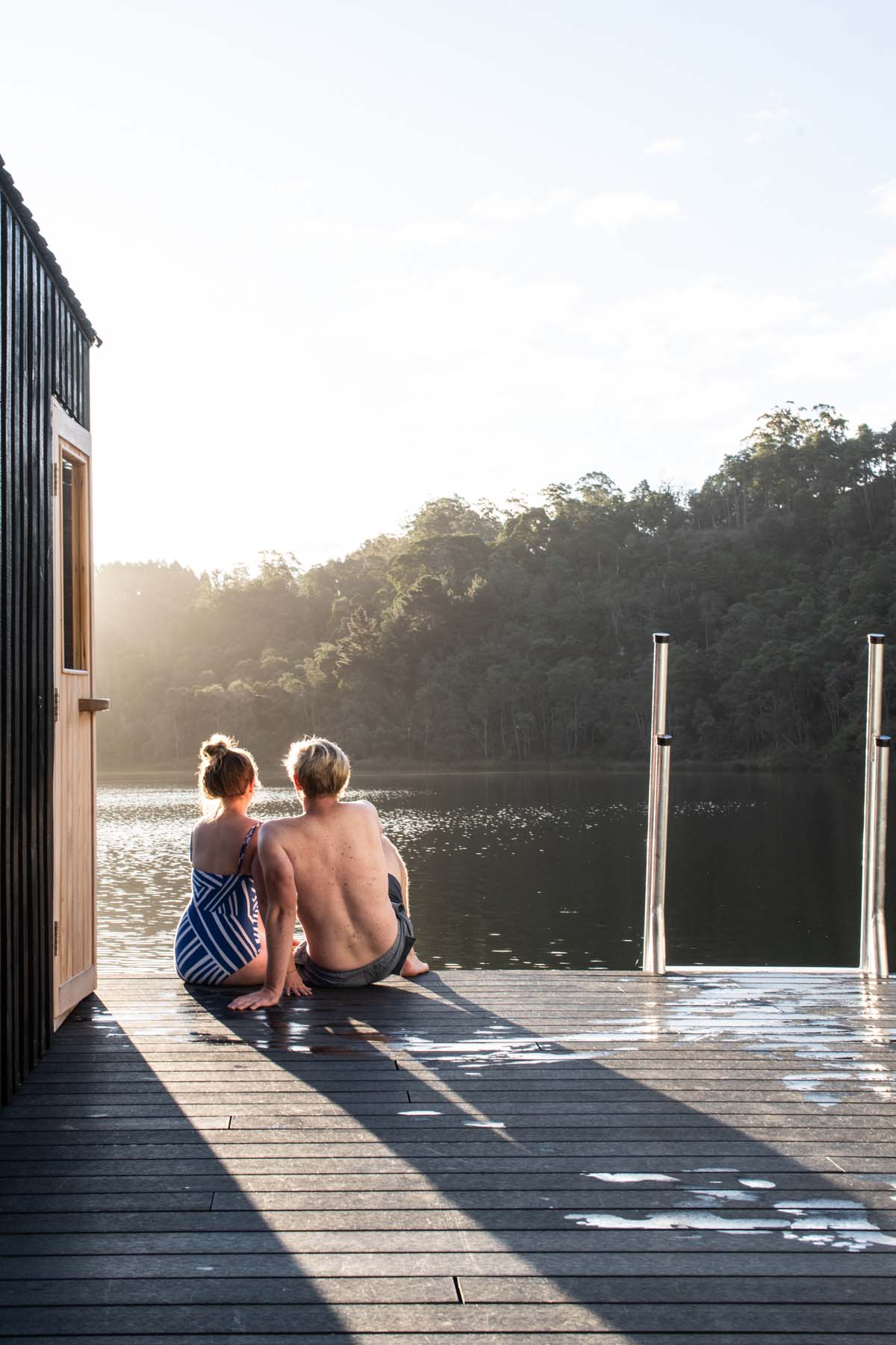 Licht Architecture built a floating sauna with black and white volumes on Tasmanian's Derby Lake