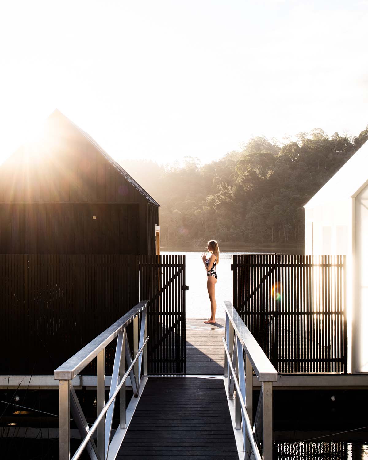 Licht Architecture built a floating sauna with black and white volumes on Tasmanian's Derby Lake