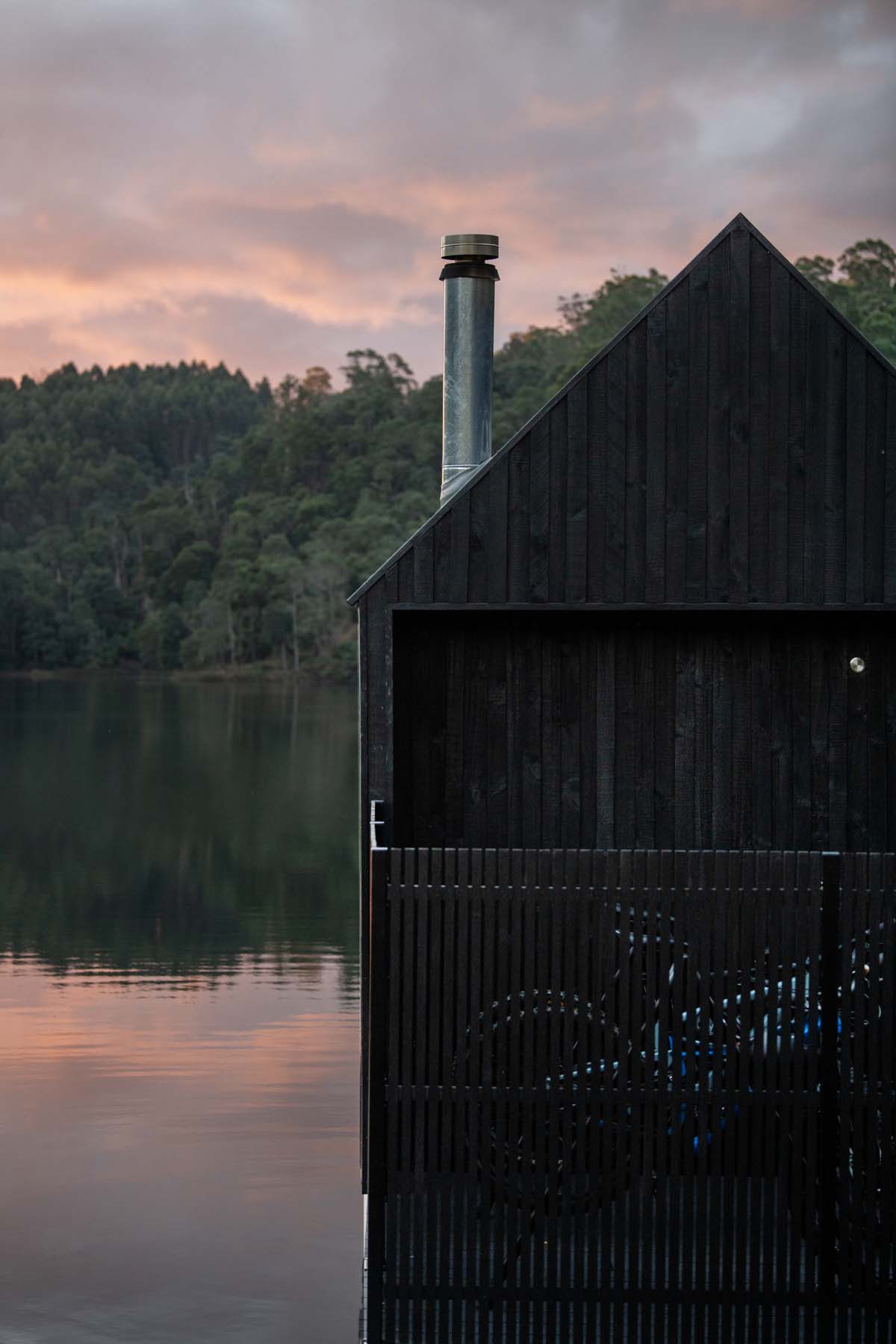Licht Architecture built a floating sauna with black and white volumes on Tasmanian's Derby Lake