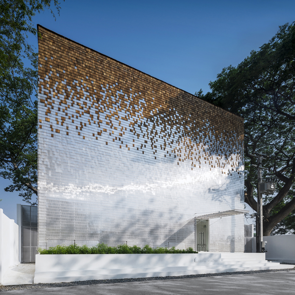 Department of Architecture wraps this small hotel with shimmering facade in Thailand