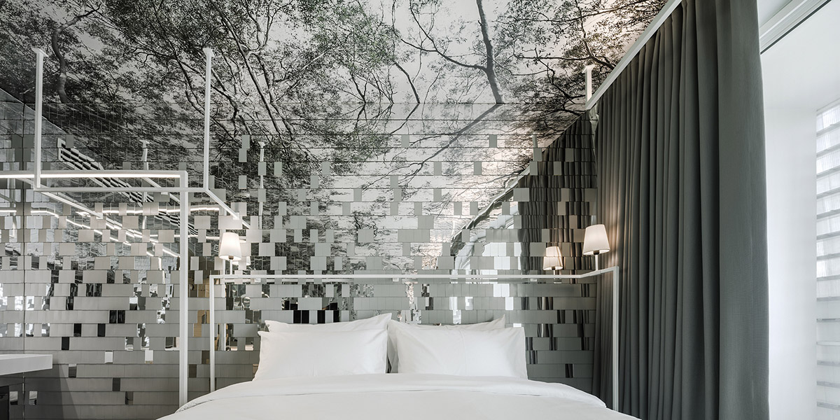 Department of Architecture wraps this small hotel with shimmering facade in Thailand