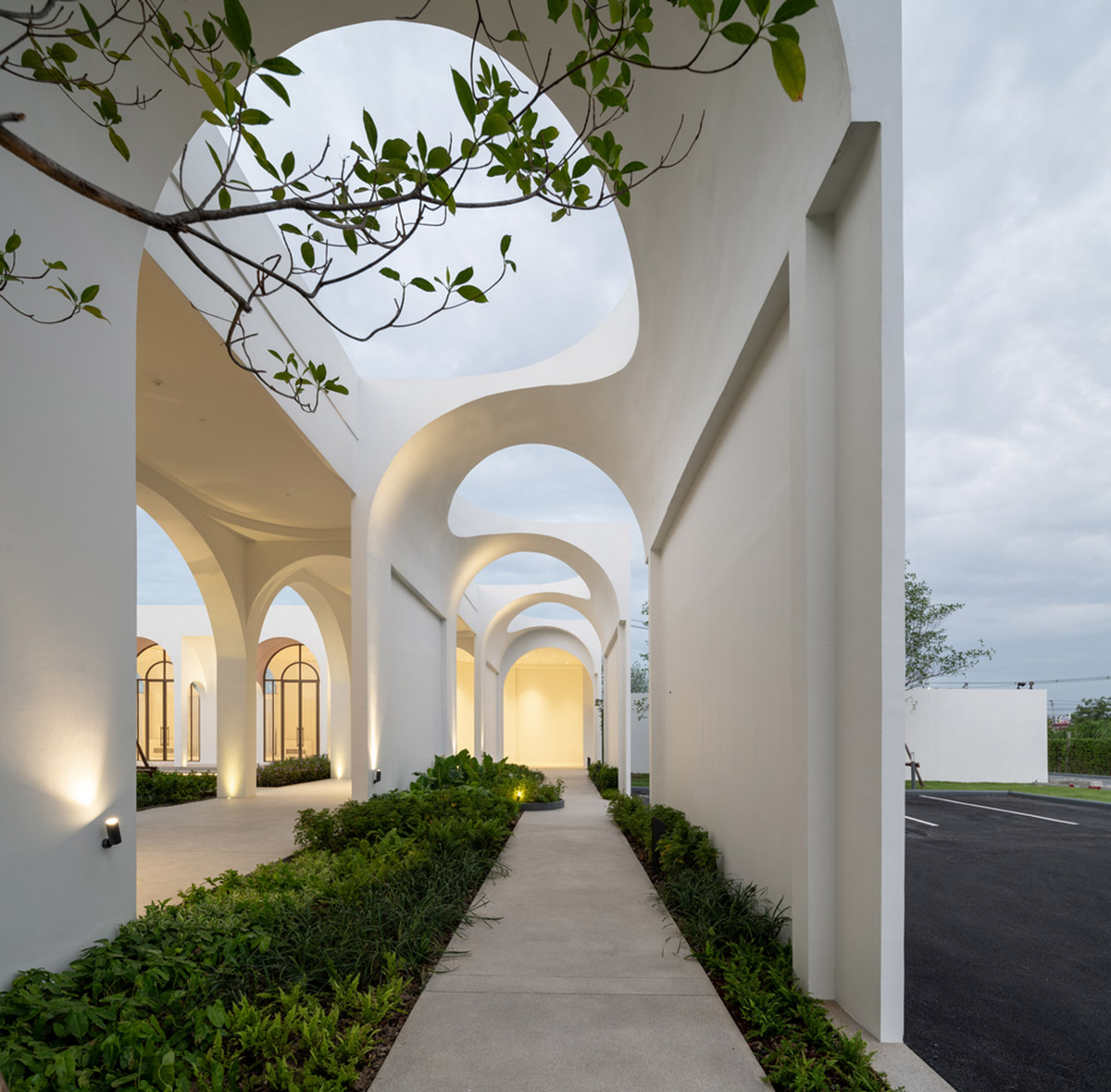 PHTAA creates flexible wedding venue with half-arch modular elements and white curved walls
