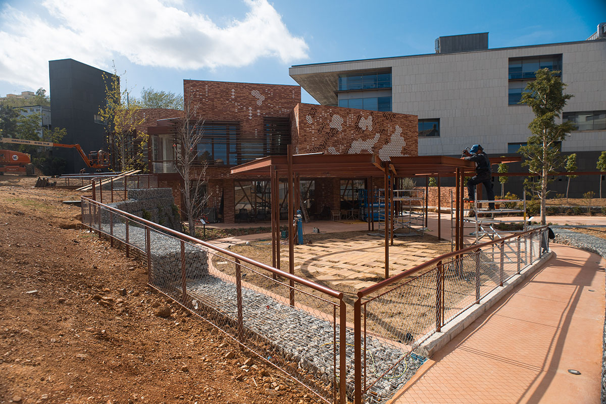 Miralles Tagliabue EMBT completes Maggie's new caring center with textured brick facade in Barcelona
