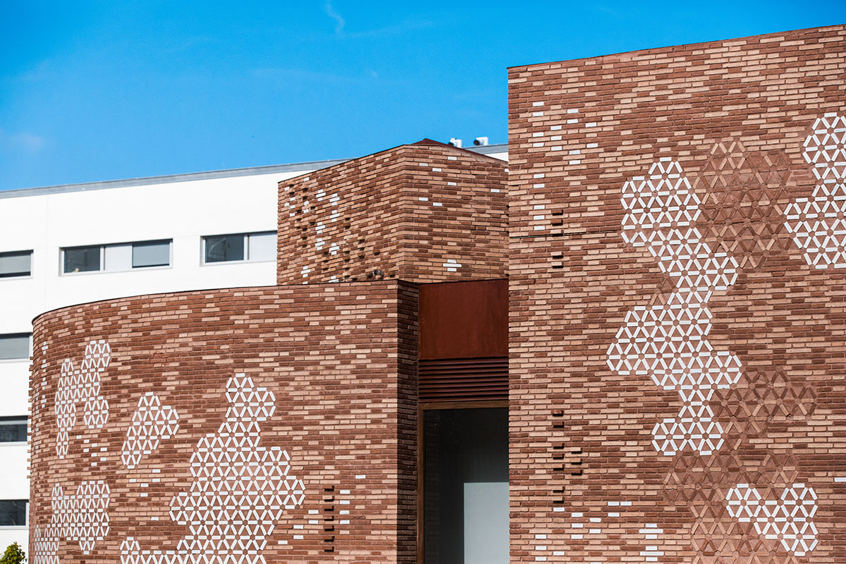 Miralles Tagliabue EMBT completes Maggie's new caring center with textured brick facade in Barcelona