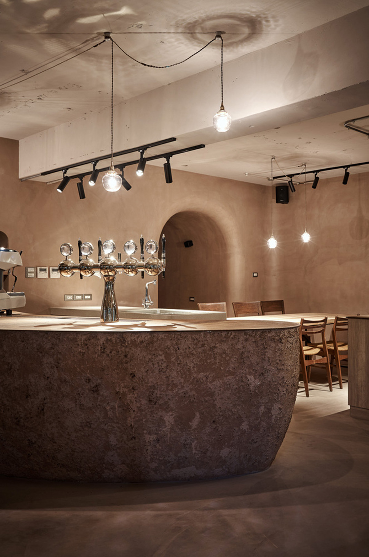 Soar Design Studio adds greenery and smooth surfaces to chocolate store offering garden-like space