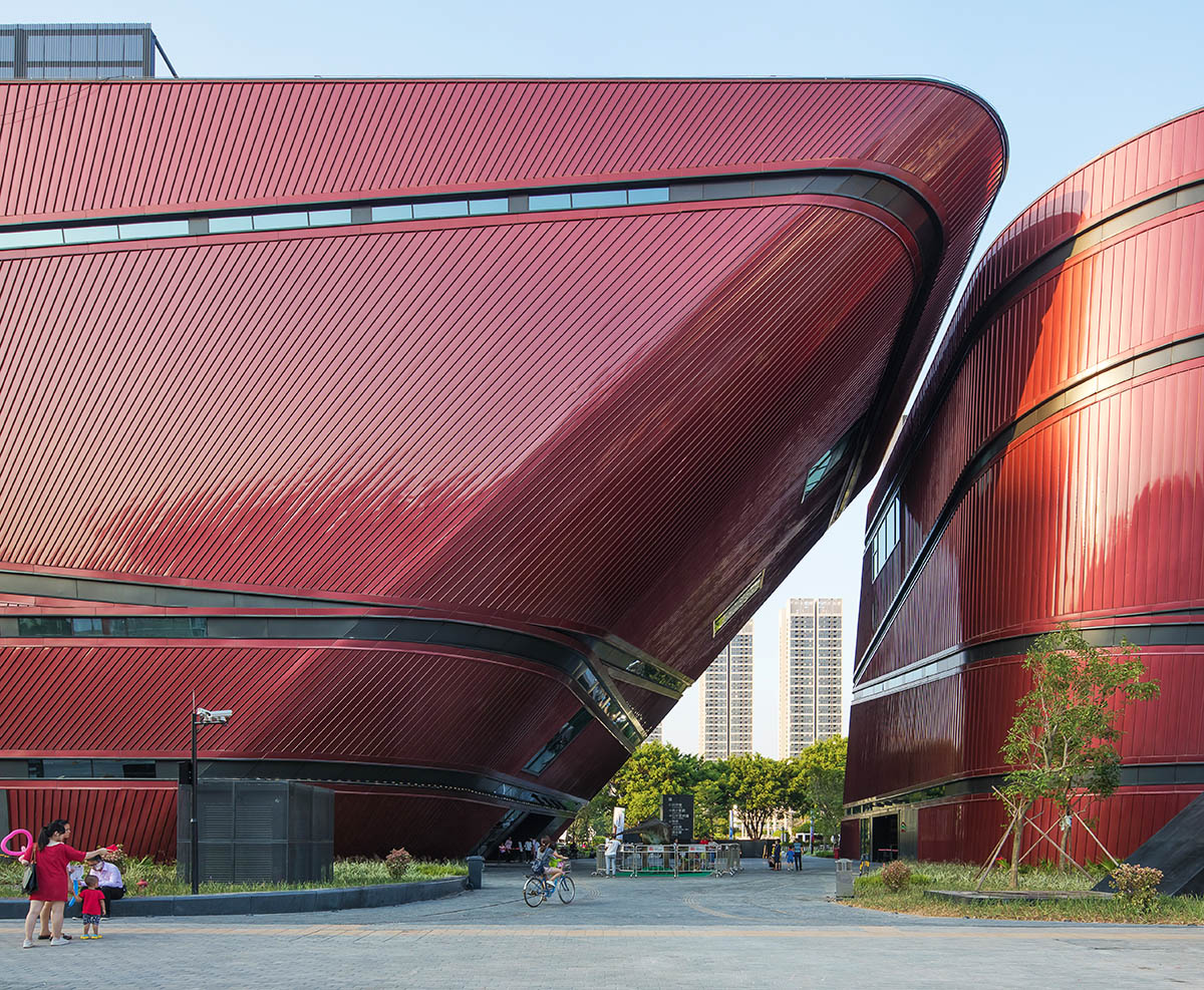 Mecanoo's Cultural Centre in Shenzhen acts as monolithic urban connector with tilted facades