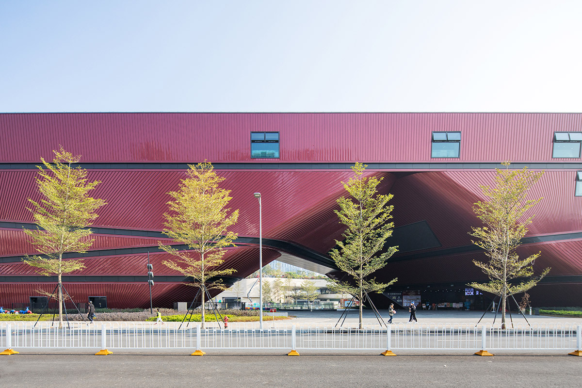 Mecanoo's Cultural Centre in Shenzhen acts as monolithic urban connector with tilted facades
