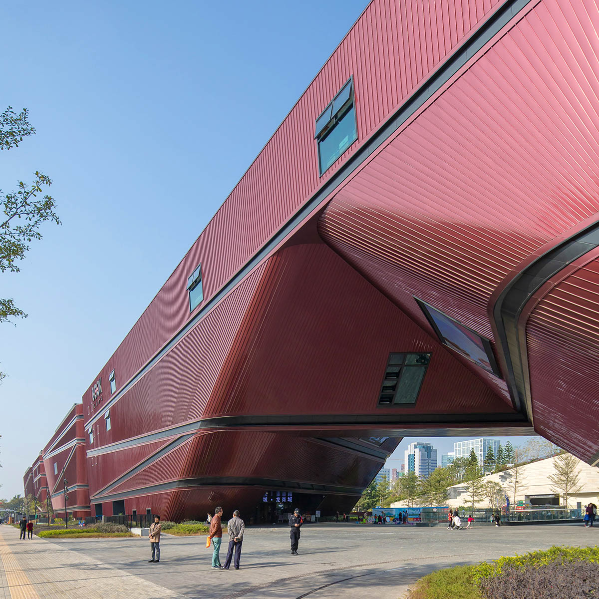 Mecanoo's Cultural Centre in Shenzhen acts as monolithic urban connector with tilted facades
