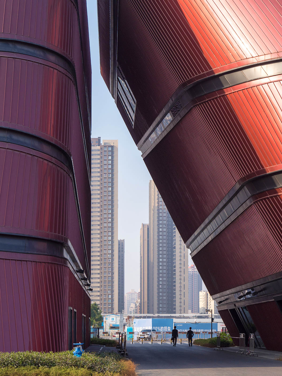 Mecanoo's Cultural Centre in Shenzhen acts as monolithic urban connector with tilted facades