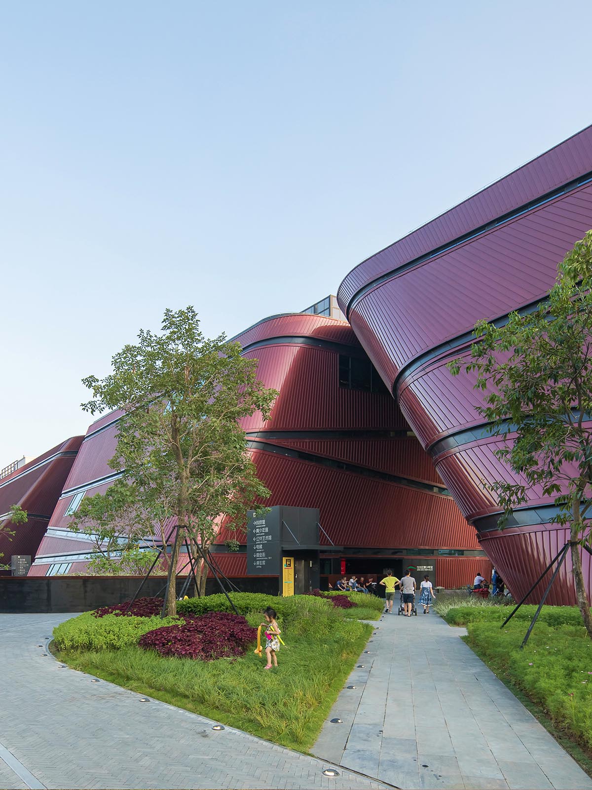 Mecanoo's Cultural Centre in Shenzhen acts as monolithic urban connector with tilted facades