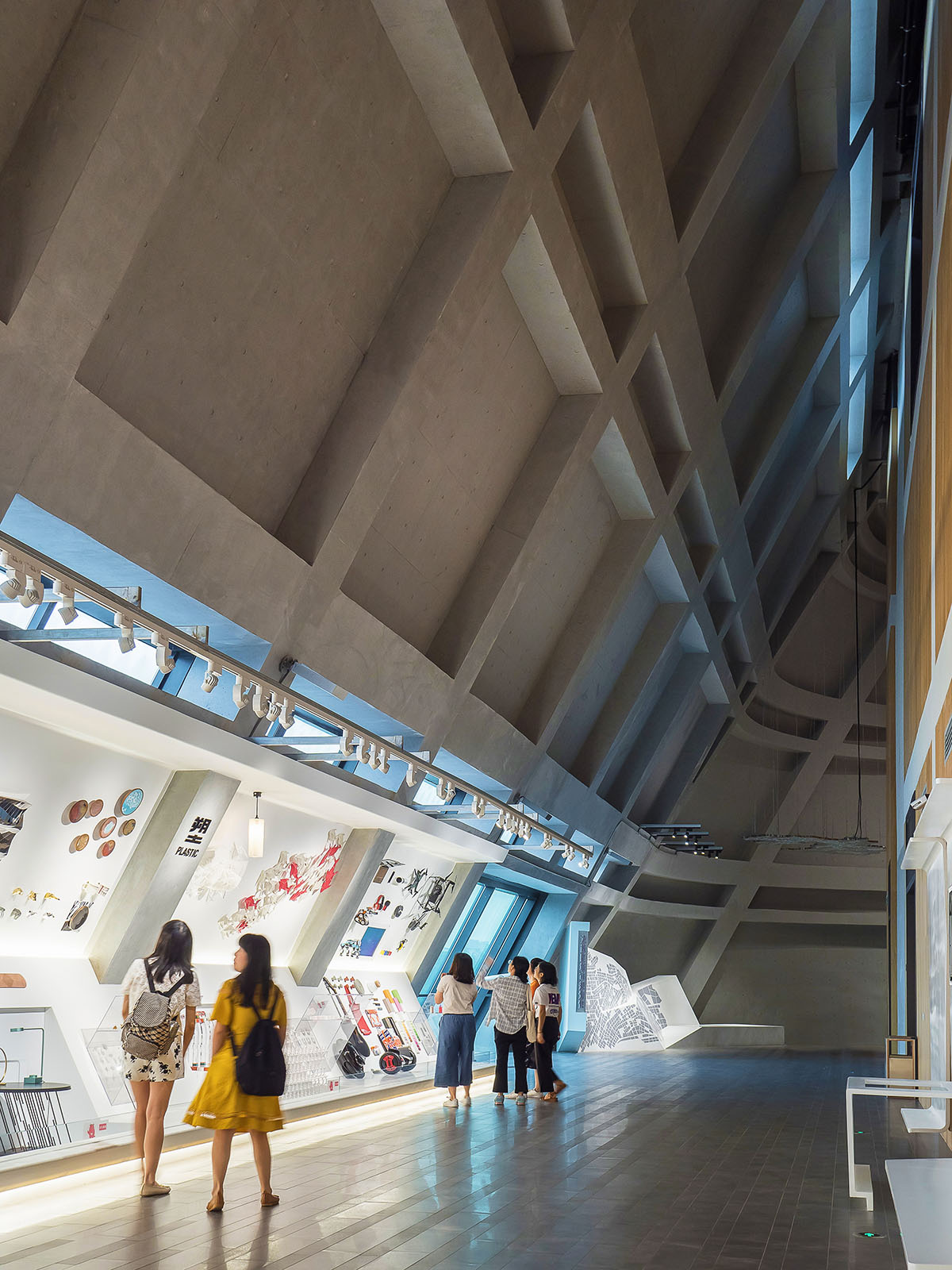 Mecanoo's Cultural Centre in Shenzhen acts as monolithic urban connector with tilted facades