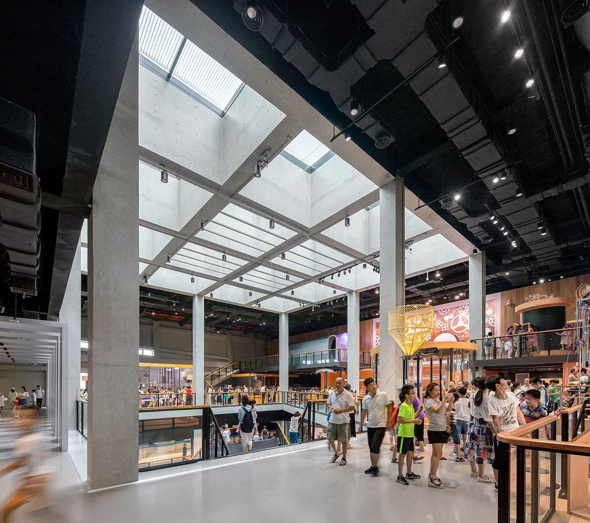 Mecanoo's Cultural Centre in Shenzhen acts as monolithic urban connector with tilted facades