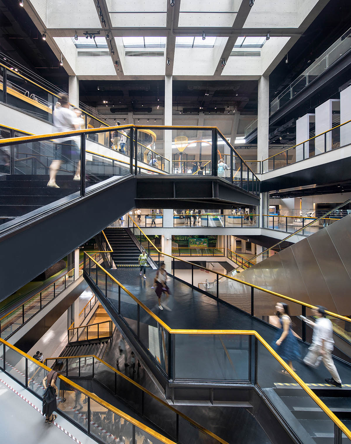 Mecanoo's Cultural Centre in Shenzhen acts as monolithic urban connector with tilted facades