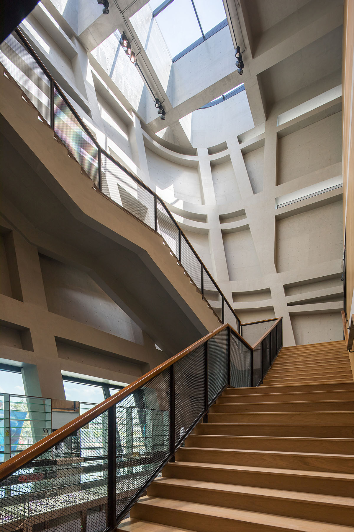 Mecanoo's Cultural Centre in Shenzhen acts as monolithic urban connector with tilted facades