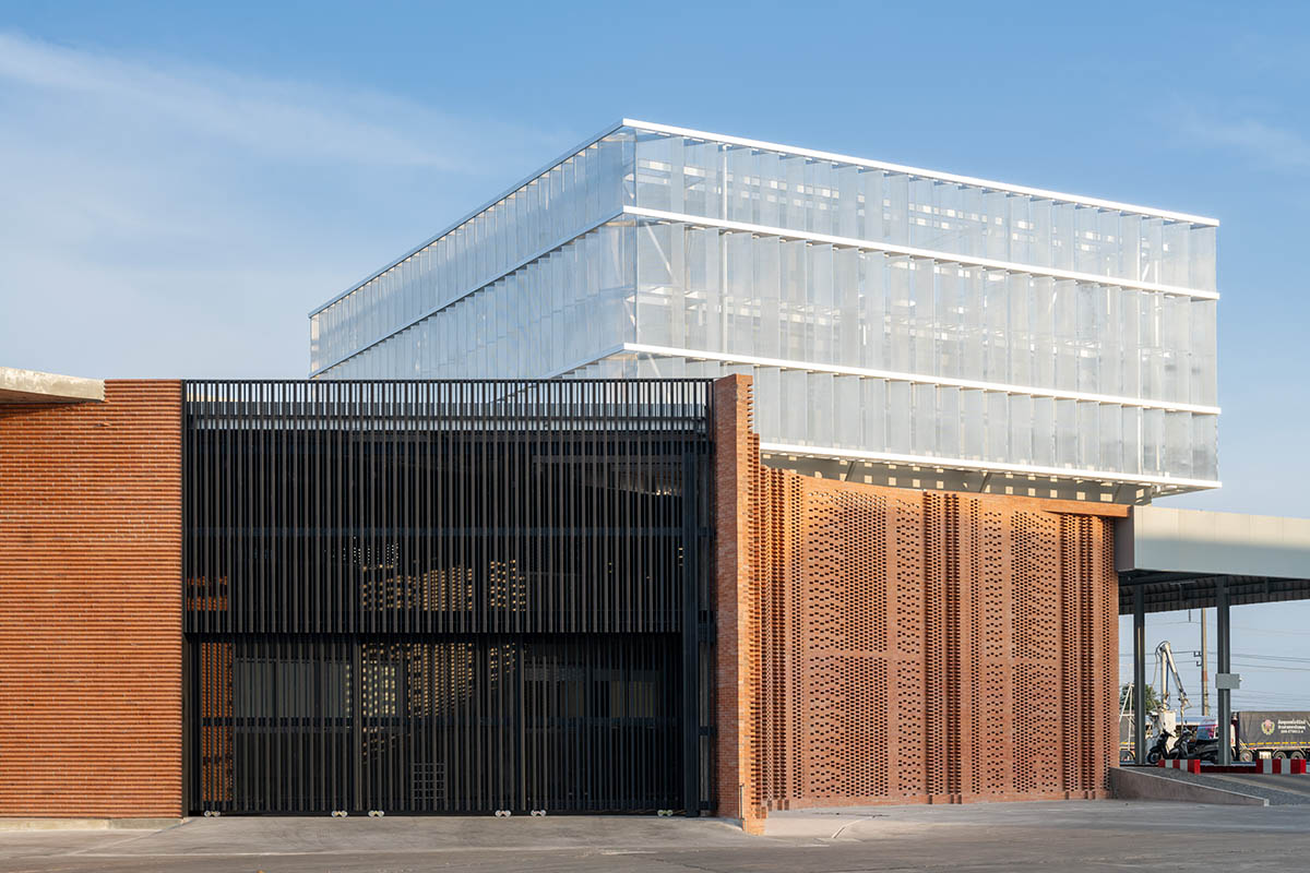PHTAA living design completes Lorpoonphol Rice Mill Office featuring zig-zag brick wall in Thailand