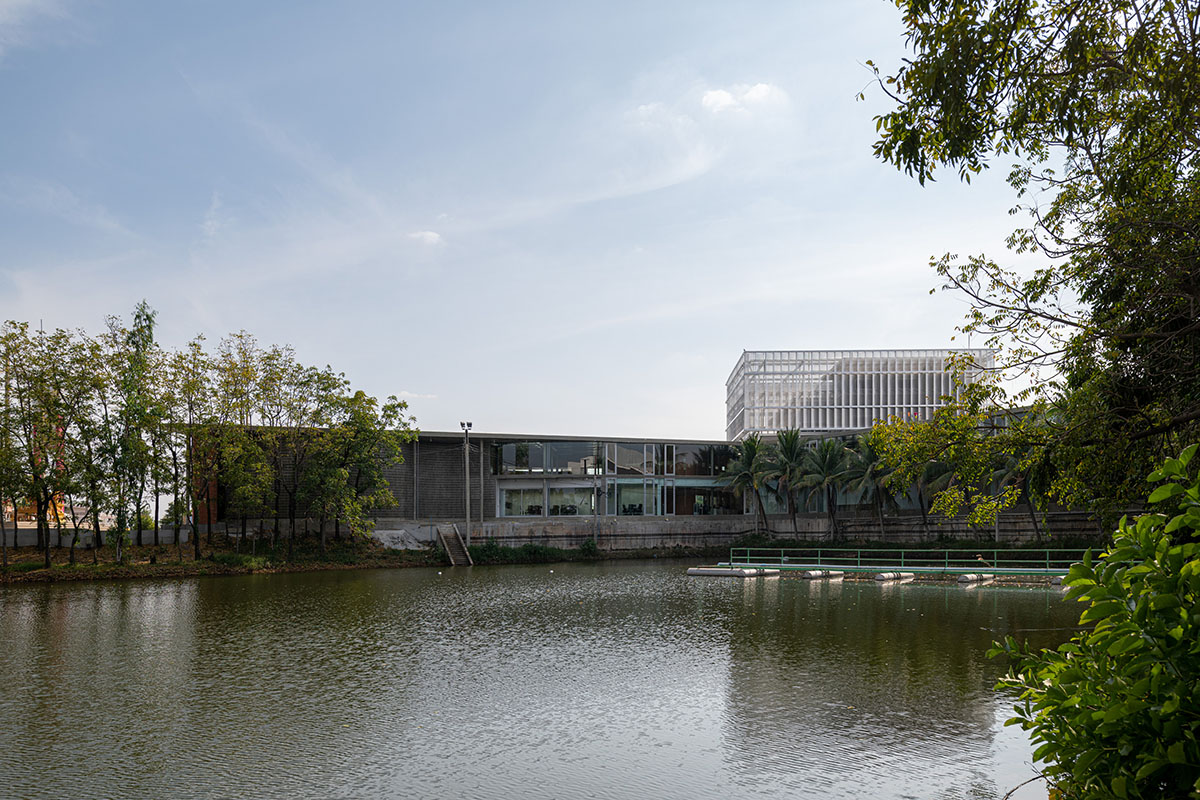 PHTAA living design completes Lorpoonphol Rice Mill Office featuring zig-zag brick wall in Thailand