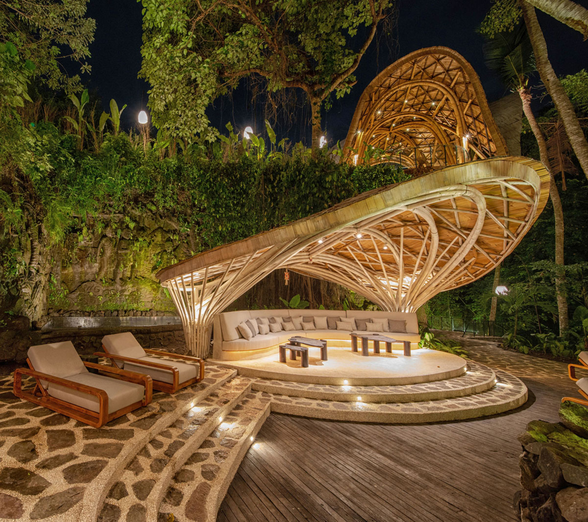 Undulating bamboo roofs wrap this wellness retreat in a lush forest of Bali