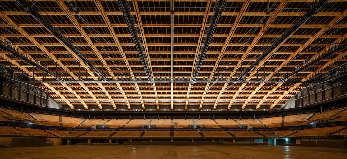 Nikken Sekkei and Shimizu Corporation-designed gymnastics centre features a floating wooden vessel