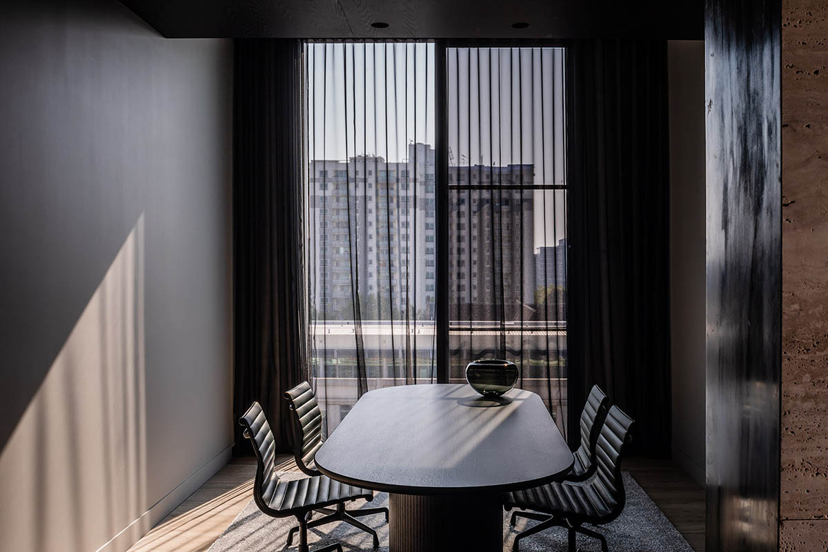 Piccolo House by Wood Marsh features coloured reflective glass elements in South Melbourne