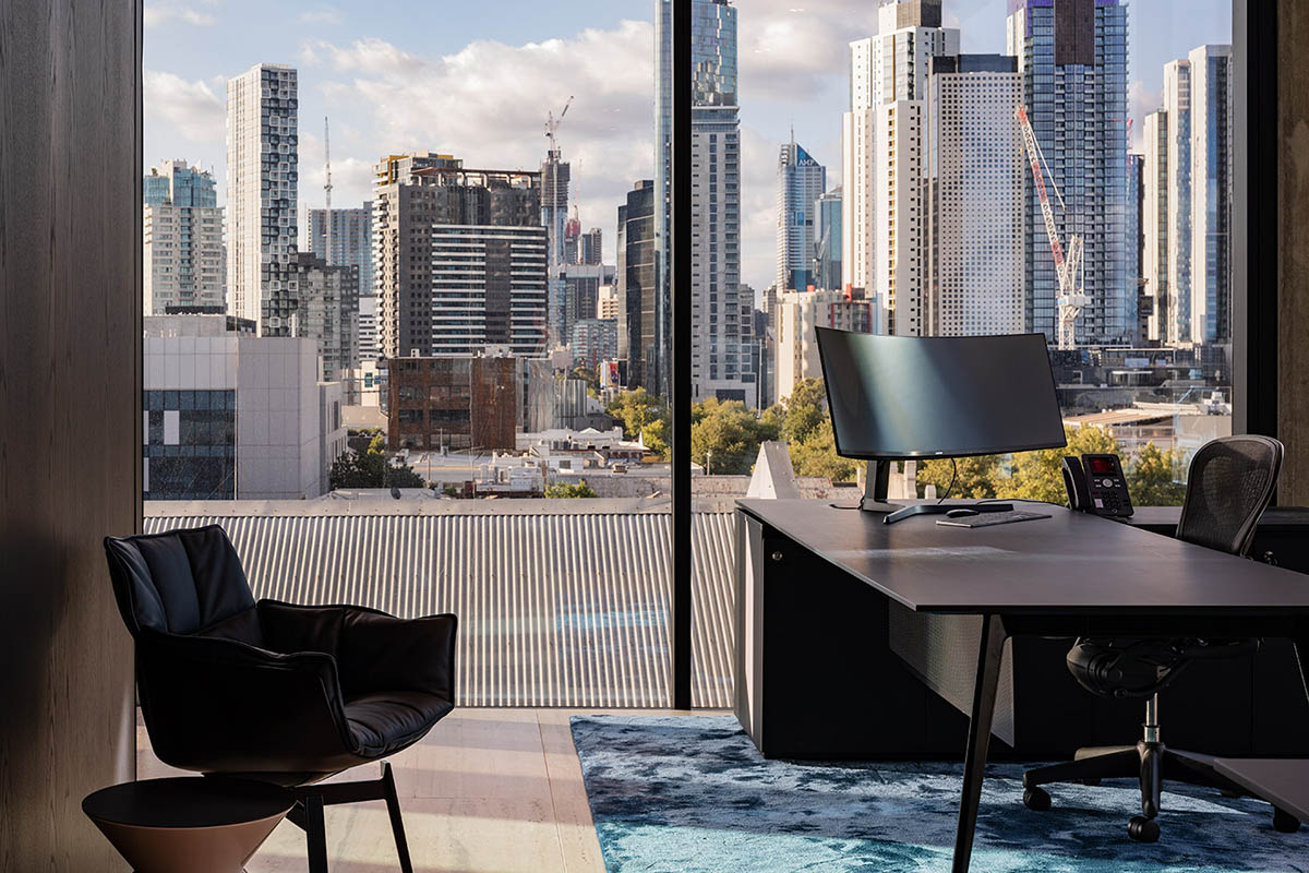 Piccolo House by Wood Marsh features coloured reflective glass elements in South Melbourne