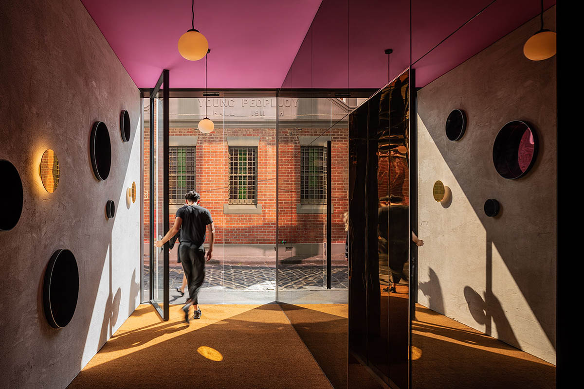 Piccolo House by Wood Marsh features coloured reflective glass elements in South Melbourne