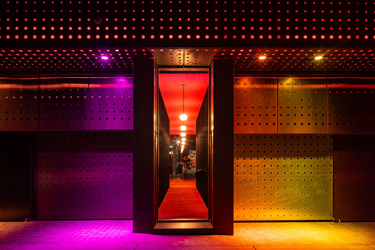 Piccolo House by Wood Marsh features coloured reflective glass elements in South Melbourne