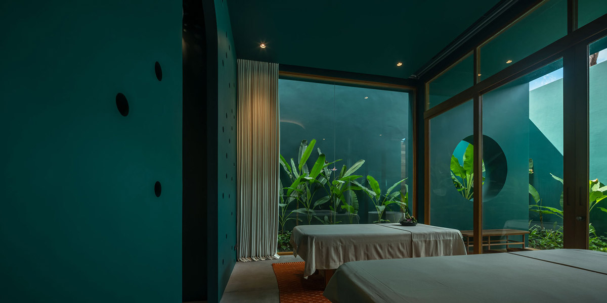 onion combines white concave and convex walls with colorful surfaces for beach resort in Thailand