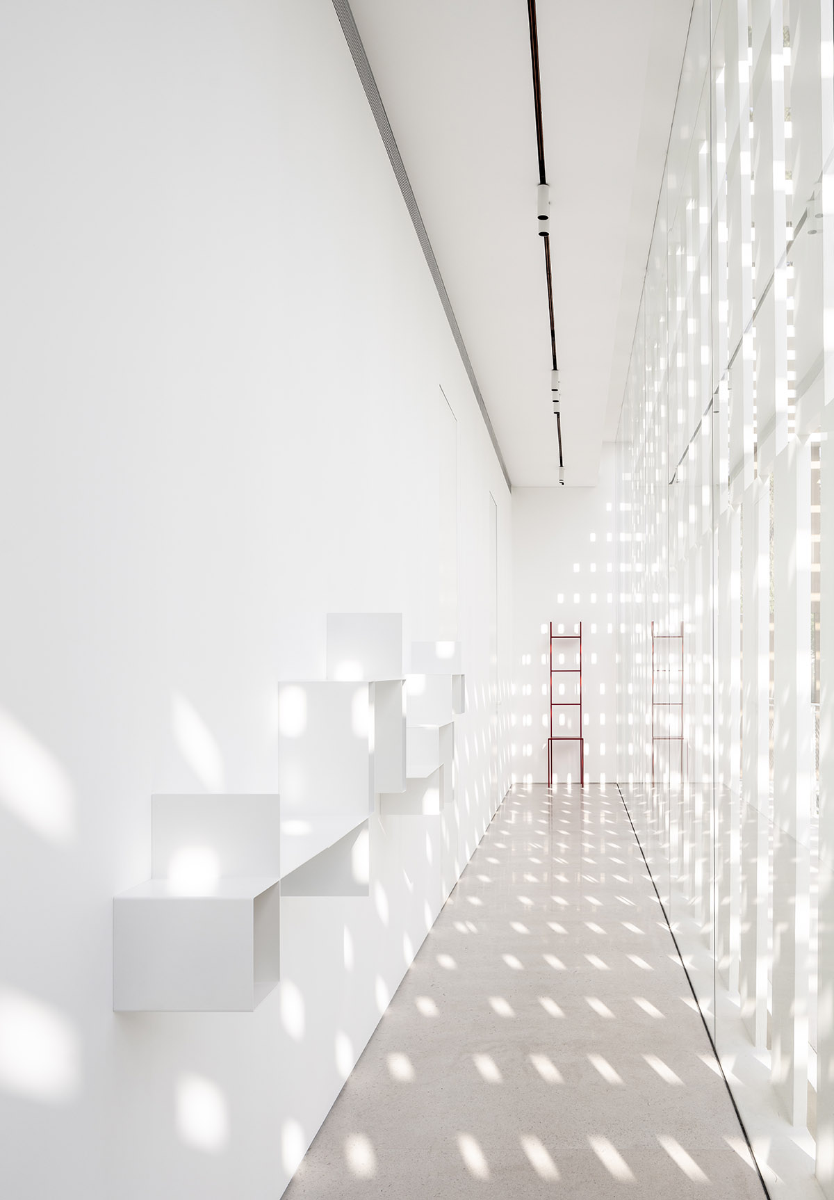 Large sunken yard defines the program of Split House designed by Pitsou Kedem Architects in Israel