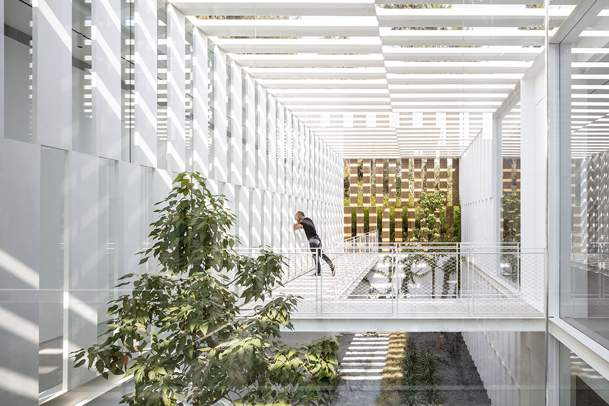 Large sunken yard defines the program of Split House designed by Pitsou Kedem Architects in Israel