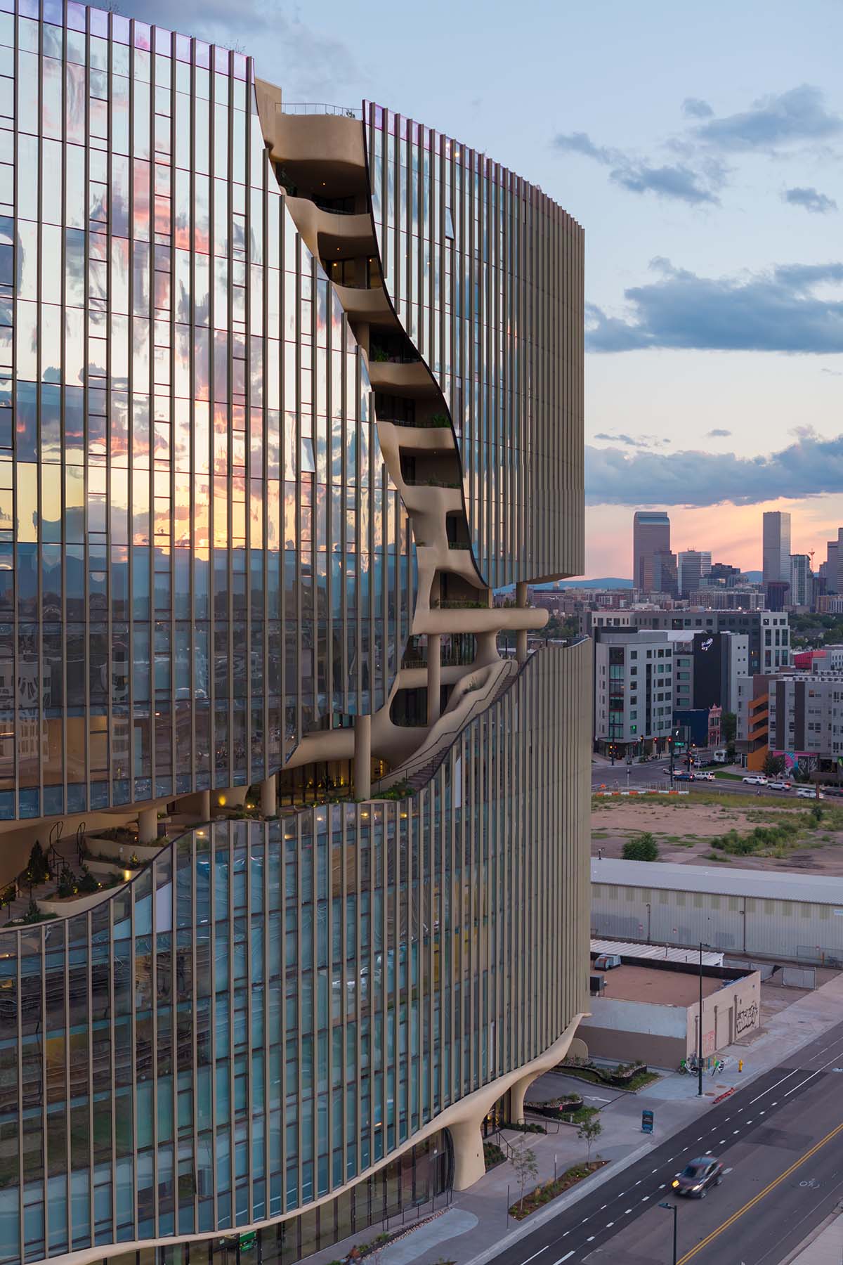 MAD reveals mixed-use tower that features a cracked-open canyon in the heart of Denver
