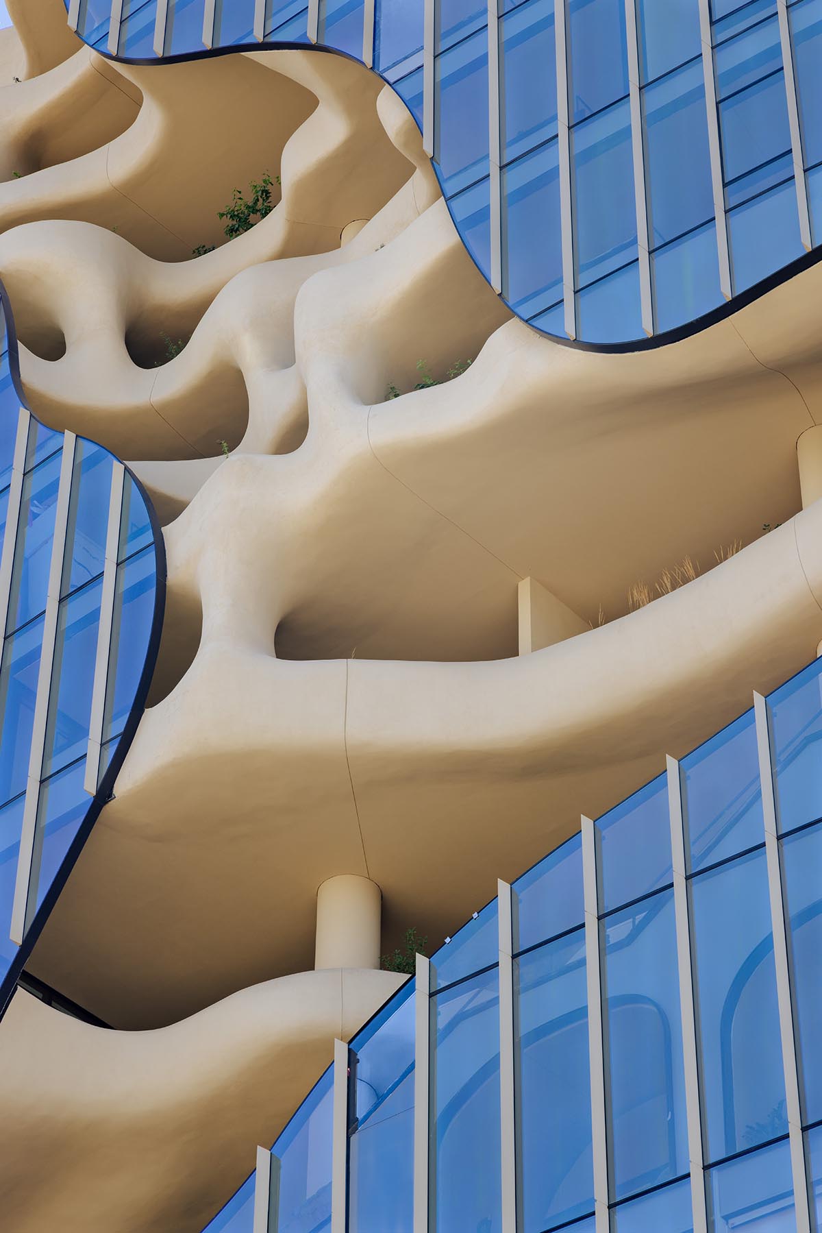 MAD reveals mixed-use tower that features a cracked-open canyon in the heart of Denver