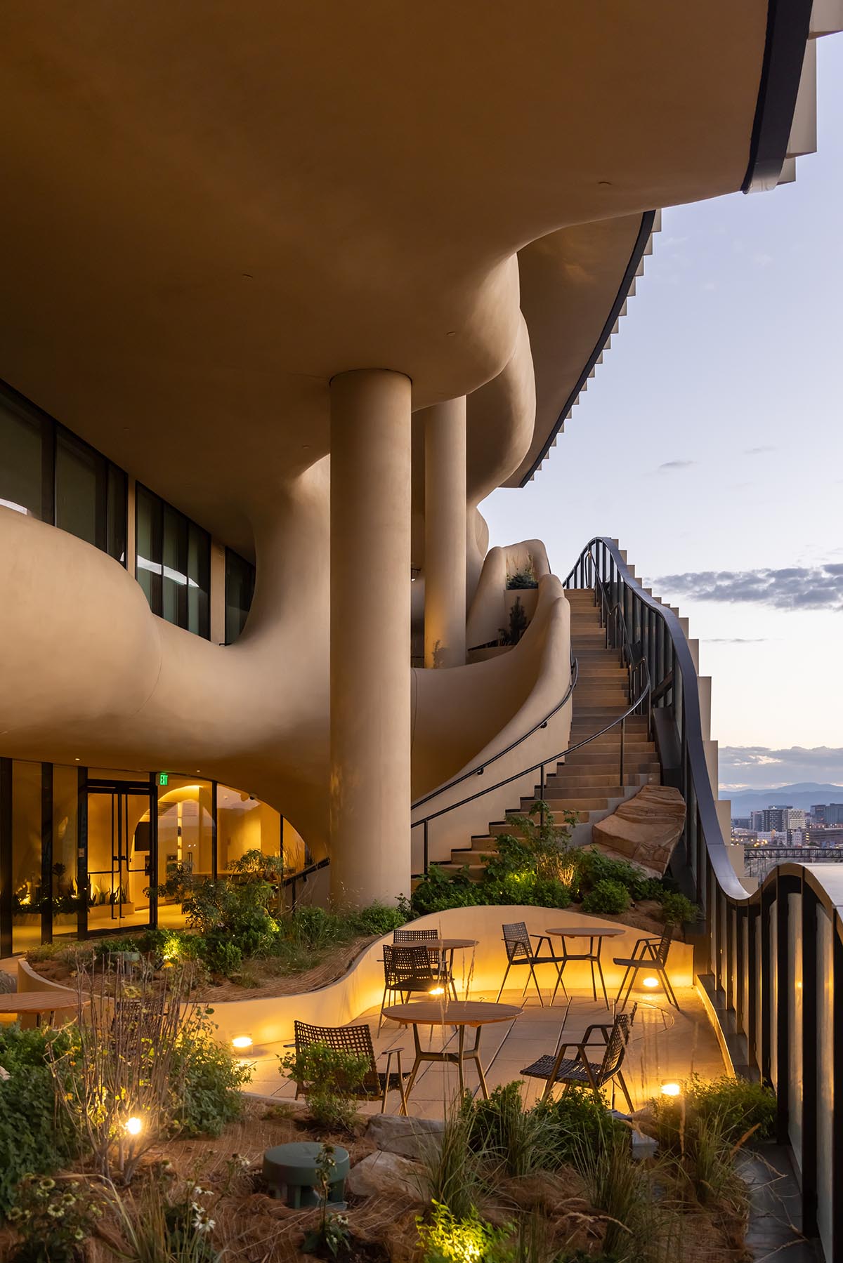 MAD reveals mixed-use tower that features a cracked-open canyon in the heart of Denver