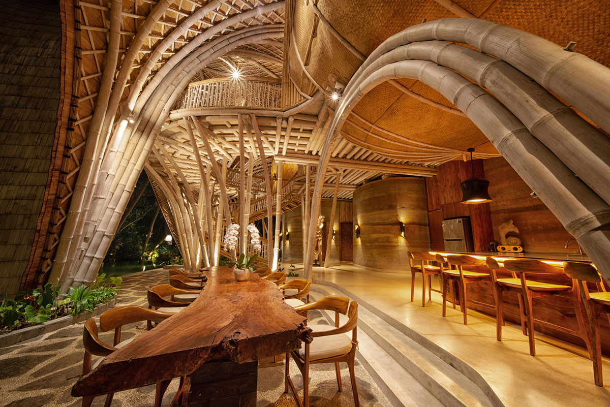 Undulating bamboo roofs wrap this wellness retreat in a lush forest of Bali