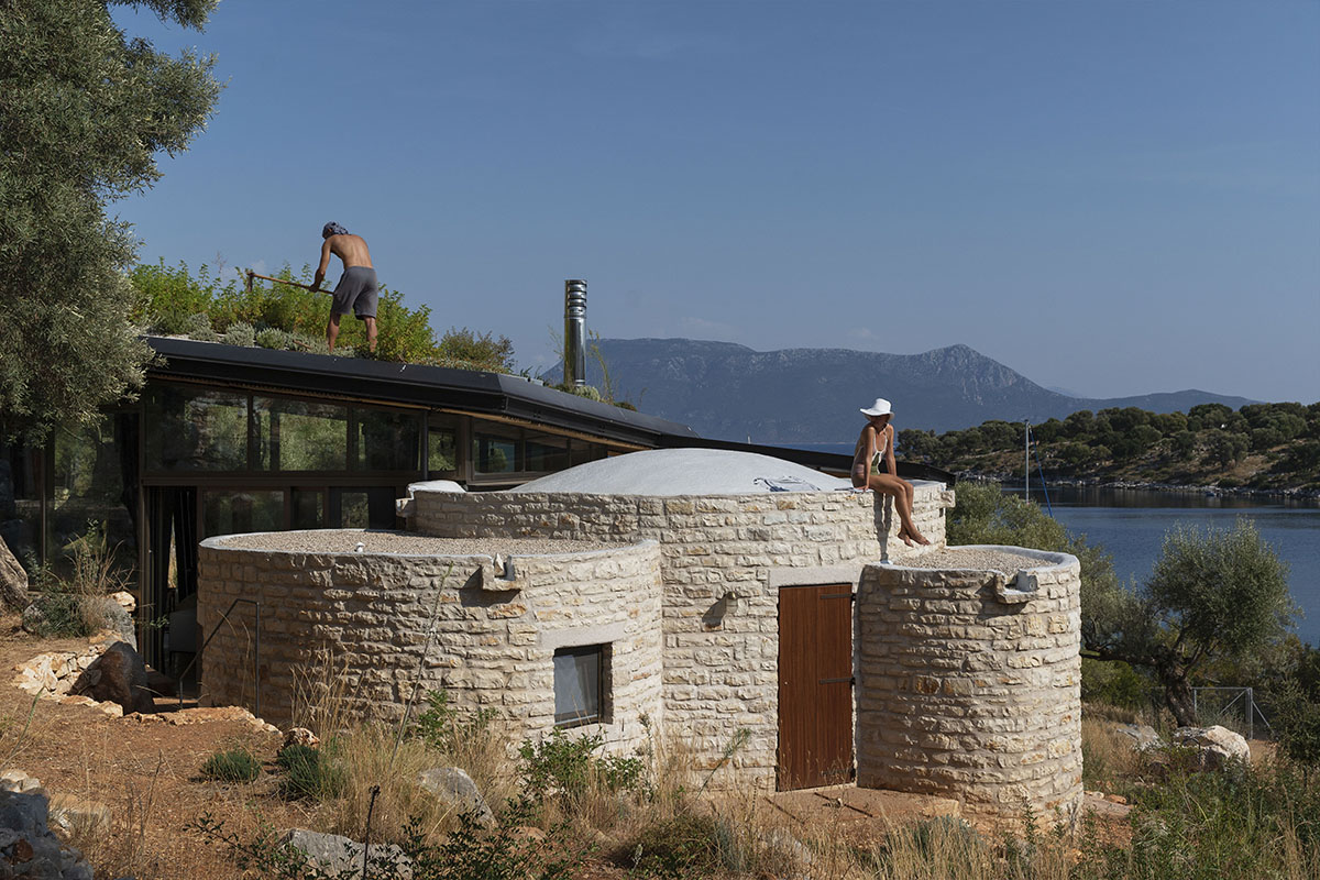 Pastoral round stone dwellings inform Meganisi House by Hiboux Architecture on Meganisi island