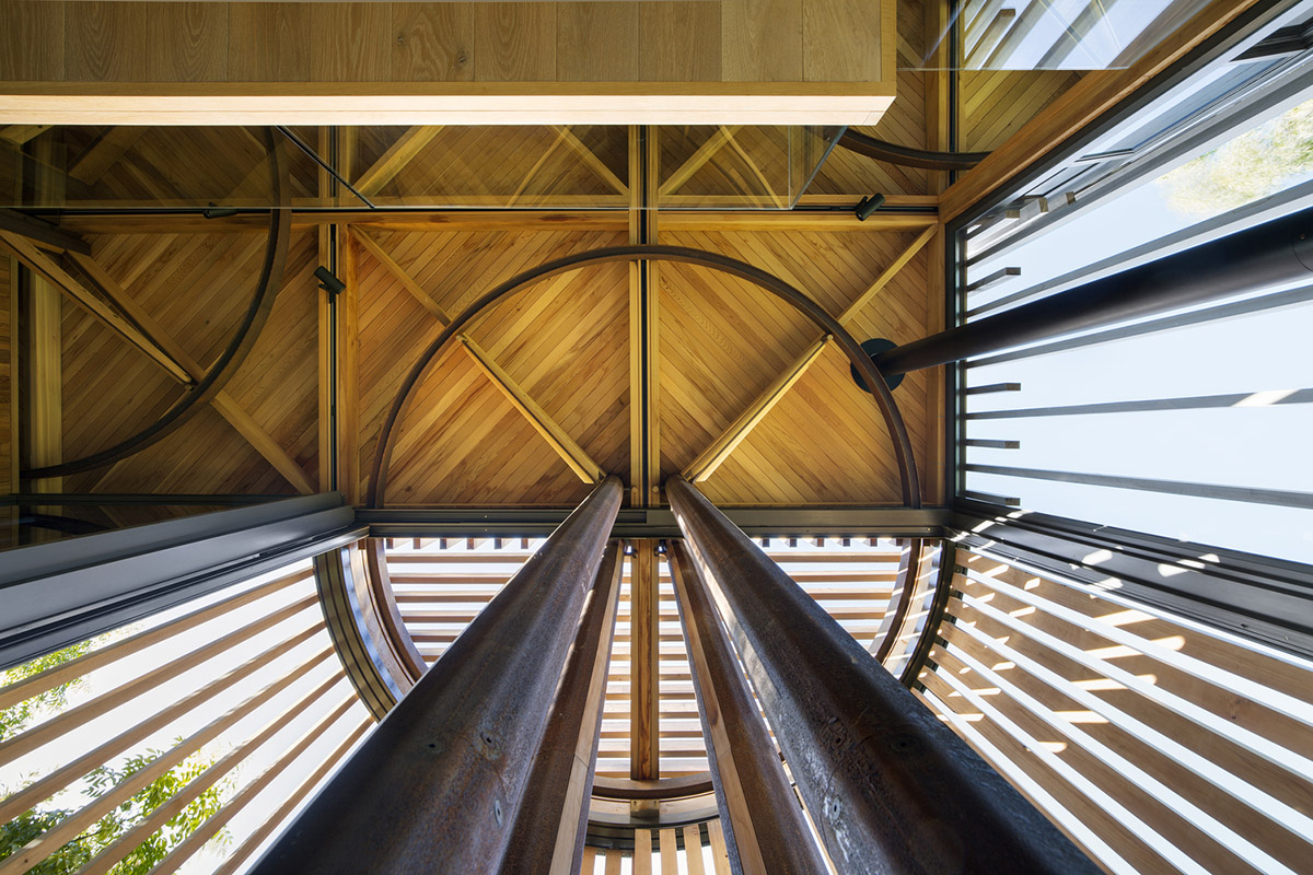 Circular tree house is raised over slender stilts to dominate the forest in every direction