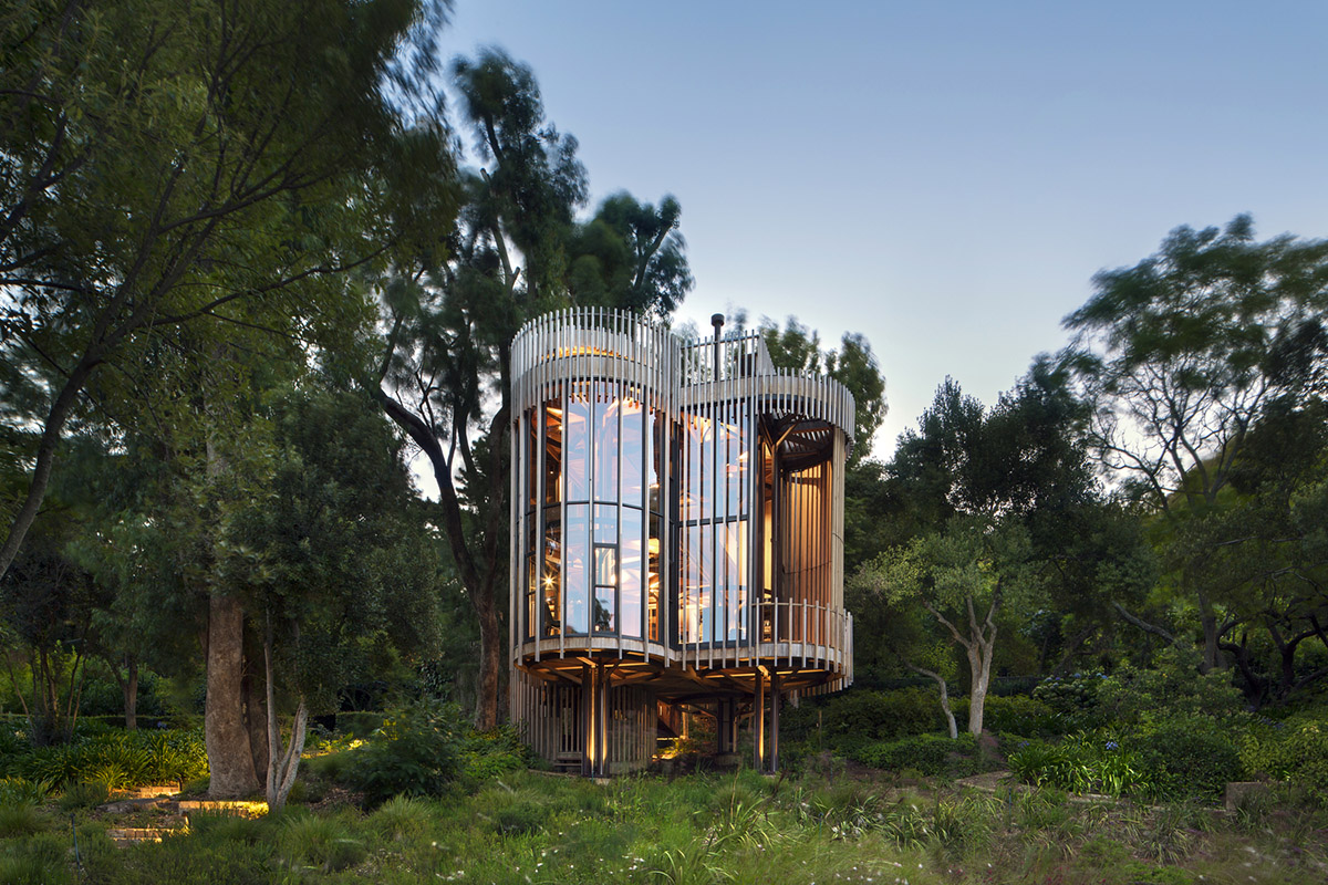 Circular Tree House Is Raised Over Slender Stilts To Dominate The Forest In Every Direction