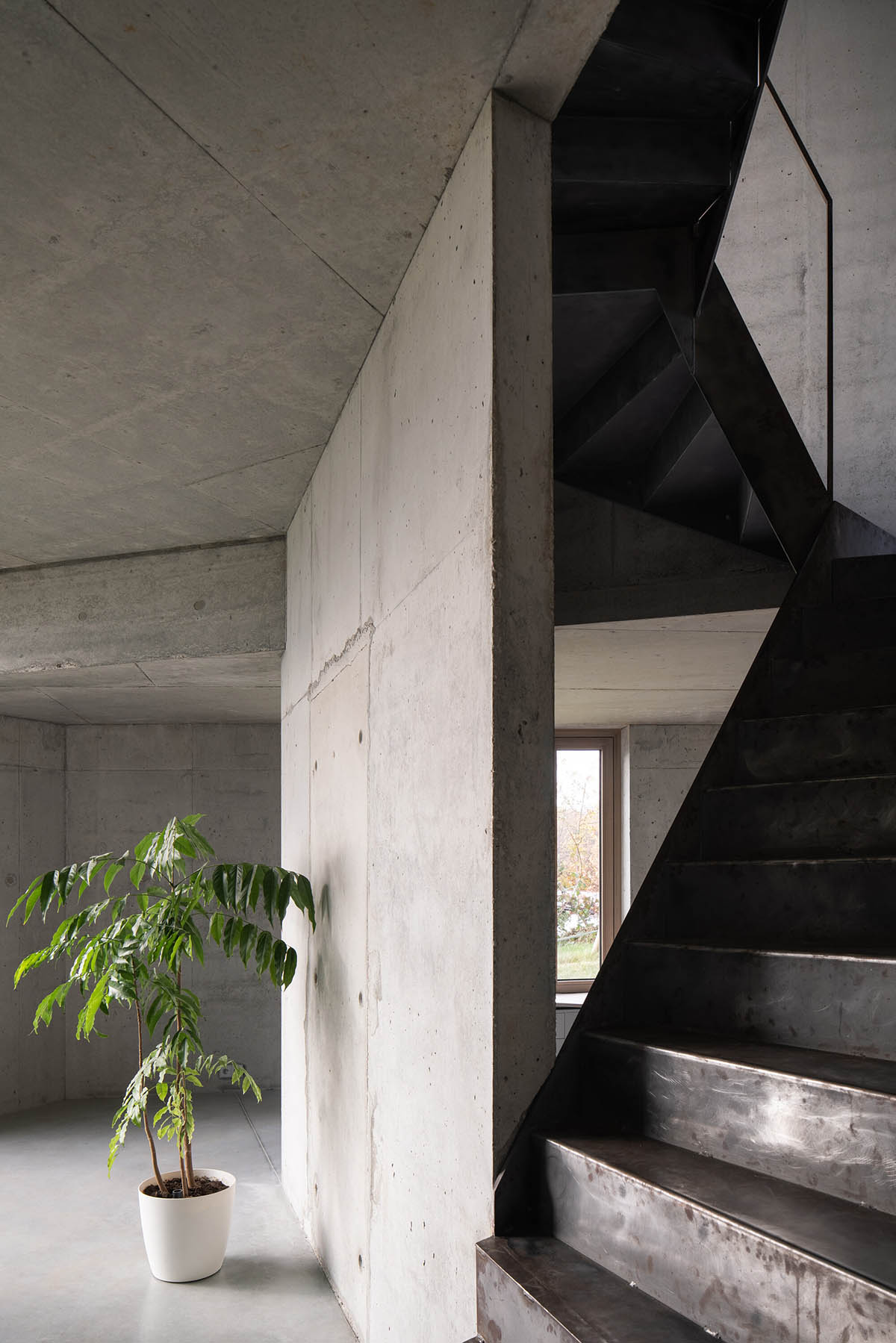 Malý Chmel creates a vertical concrete cave in a sloped garden in the Czech Republic