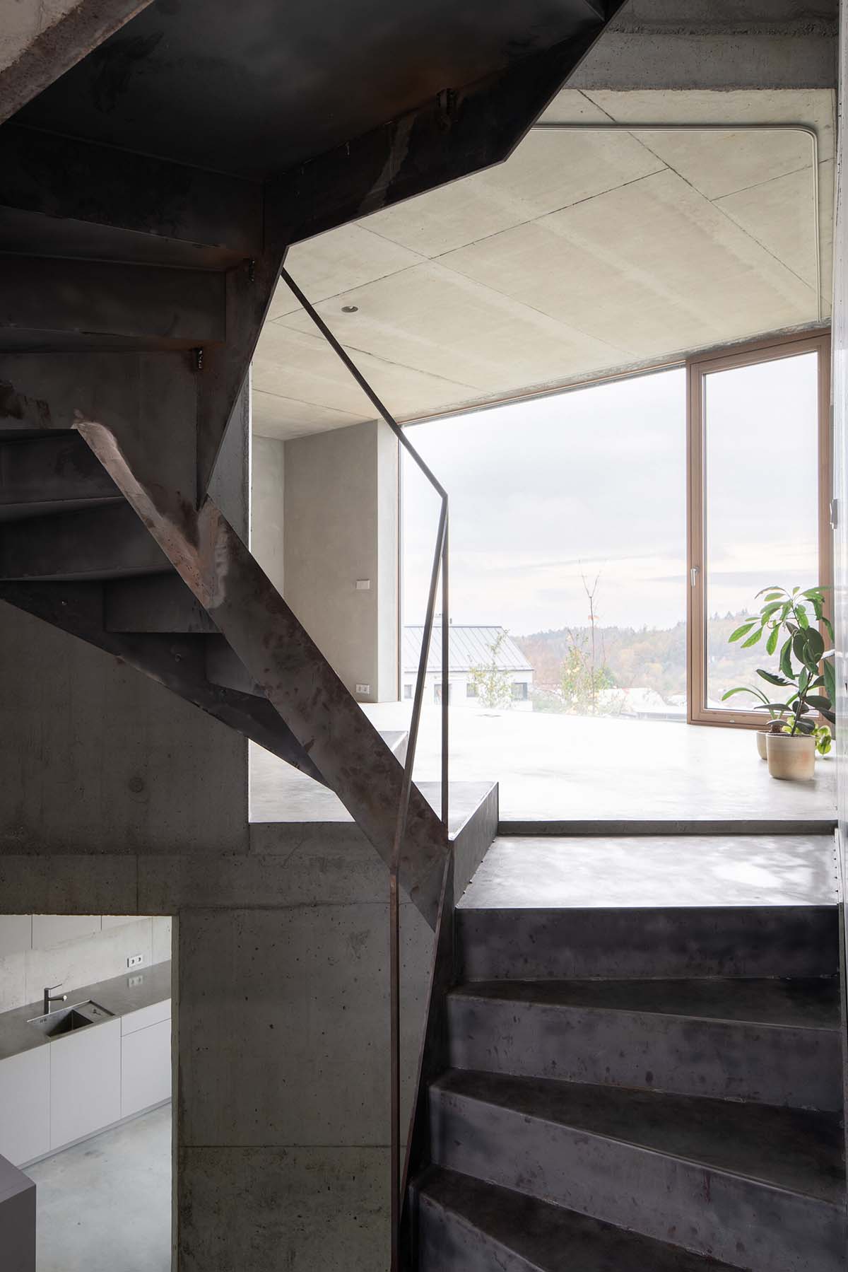 Malý Chmel creates a vertical concrete cave in a sloped garden in the Czech Republic