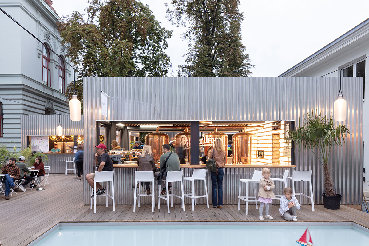Manifesto food market expands with CHYBIK + KRISTOF-designed metal cabins in Smichov district