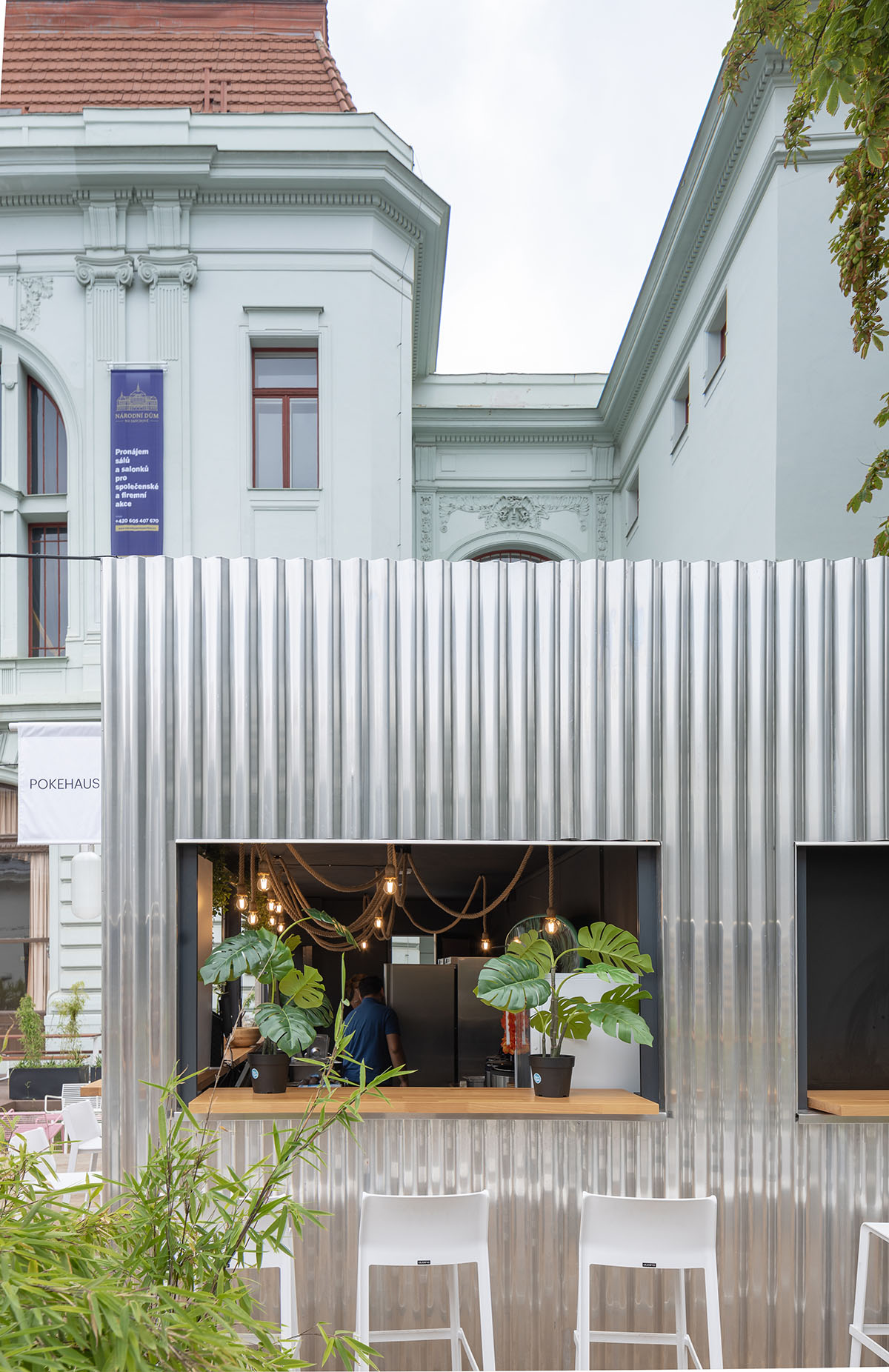 Manifesto food market expands with CHYBIK + KRISTOF-designed metal cabins in Smichov district