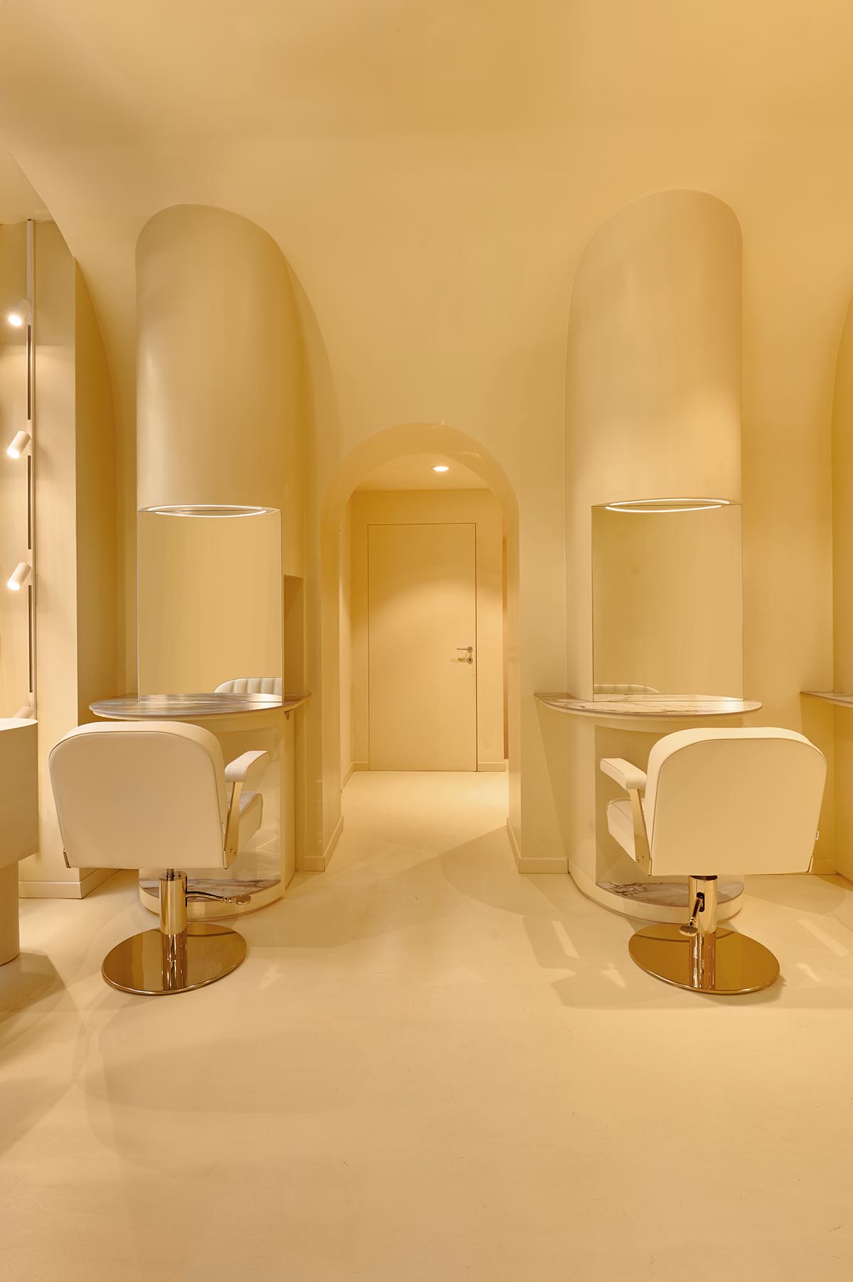 Peachy colors fill interiors of a beauty salon by Masquespacio in Milan 