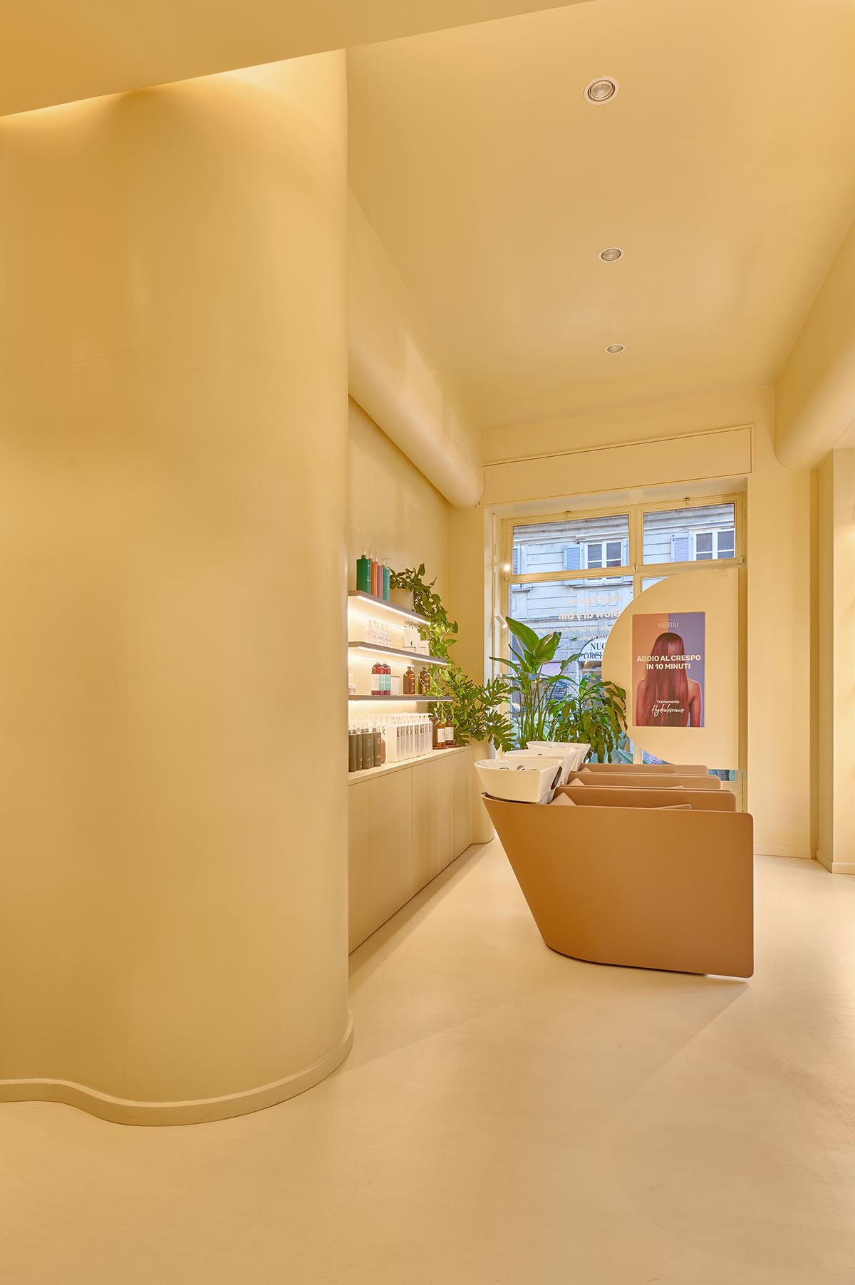 Peachy colors fill interiors of a beauty salon by Masquespacio in Milan 