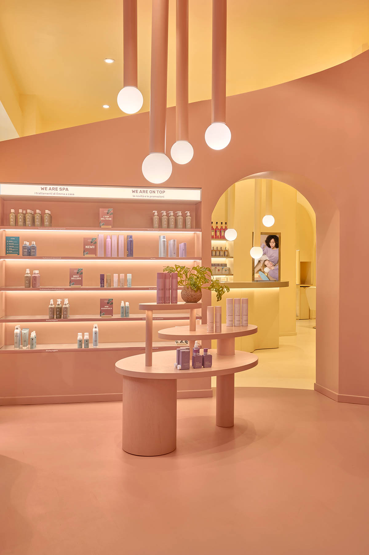 Peachy colors fill interiors of a beauty salon by Masquespacio in Milan 